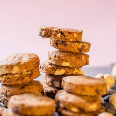 Cookies with nuts. Baking Very close on a pink background.