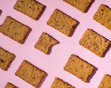 Pattern of cookies on a pink background. Bakery background
