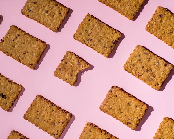 Pattern of cookies on a pink background. Bakery background