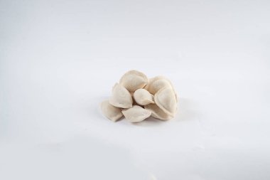 Frozen semi-finished dumplings on a white background. Dumplings isolated
