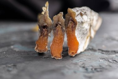 Salted dried fish. Fish appetizer for beer. Stockfish