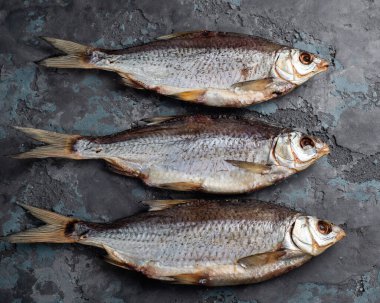 Salted dried roach fish. Fish appetizer for beer. Stockfish