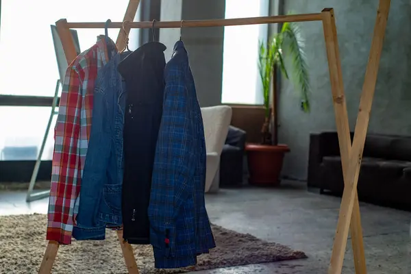 Second-hand clothes on the rail. The concept of sustainable economic life