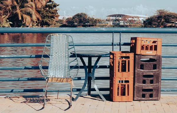 chairs on the dock on the background of the wooden pier