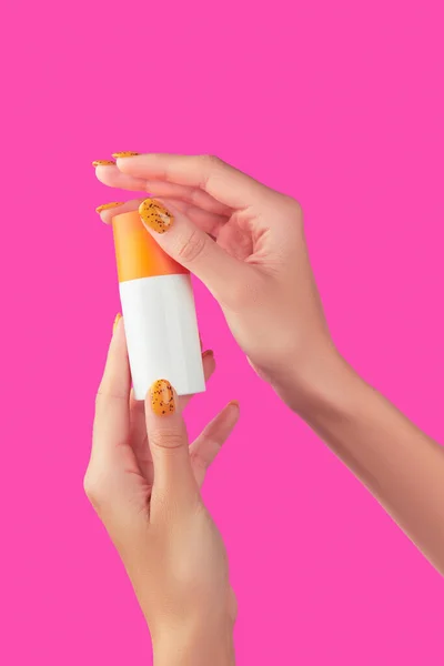 Manicured Womans Hand Holding Sunscreen Bottle Pink Background Beauty Treatment — Stock Photo, Image
