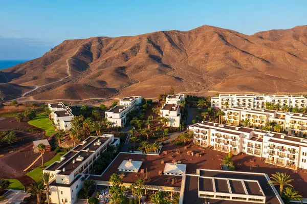 stock image Las Playitas, Spain- October 14 2021: Las Playitas Resort: A Luxurious Oasis in Canary Islands. Aerial view of resort featuring a golf course, Olympic-sized pool, and breathtaking mountain backdrop.