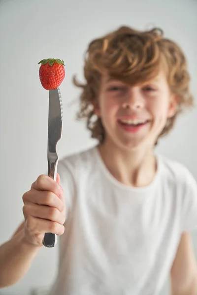 Carefree Boy Sweet Berry Pierced Knife Smiling Looking Camera White — Stock Photo, Image