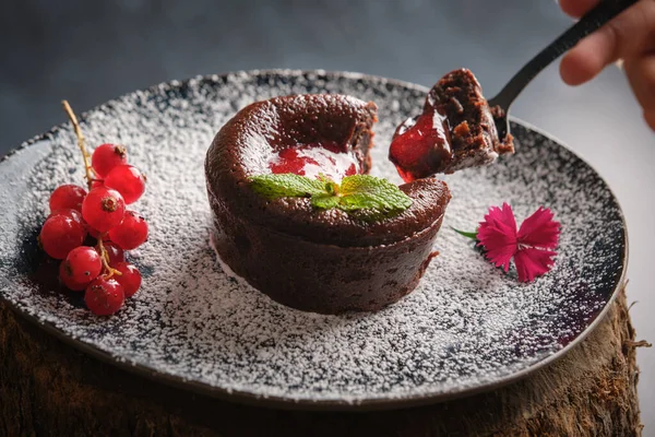 Person Taking Piece Sweet Chocolate Fondant Red Currant Jam Mint — Stock Photo, Image
