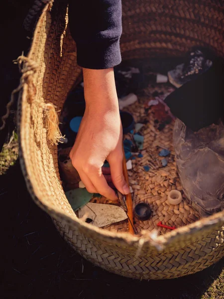 Crop Anonymous Person Putting Picked Piece Garbage Wicker Basket Heap — Stock Photo, Image