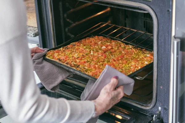 Unrecognizable Elderly Female Process Cooking Putting Vegetable Pizza Baking Tray — Stock Photo, Image