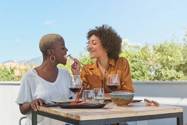 Smiling Multiethnic Women Feeding Each Other Asian Food While Having — Stock Photo, Image