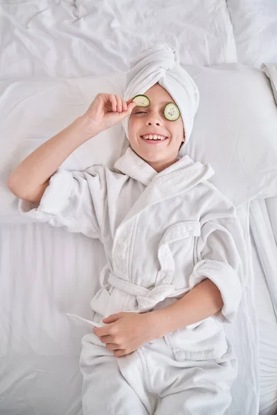 High Angle Smiling Child Wearing Towel Turban Demonstrating Cucumber Slice — Stock Photo, Image