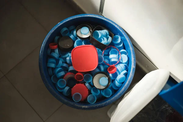 Top View Plastic Bucket Filled Colorful Bottle Caps Container Placed — Stock Photo, Image