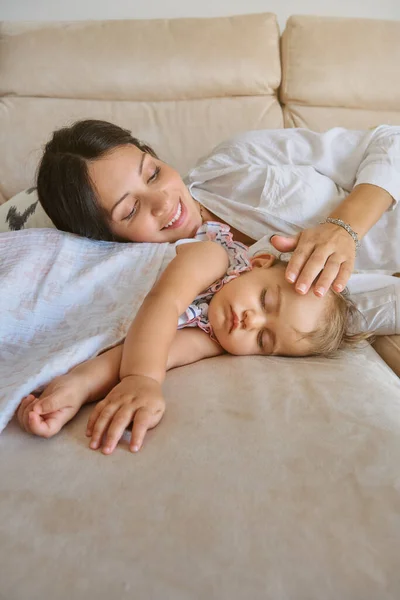 Smiling Young Woman Caressing Adorable Baby Sleeping Comfortable Sofa Living — Stock Photo, Image