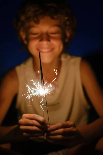 Optimistic Preteen Boy Looking Bengal Light Merrily Glowing Dark Holiday — Stock Photo, Image