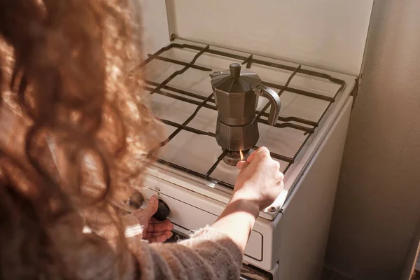 Crop Anonymous Woman Curly Hair Lighting Gas Stove While Preparing — Stock Photo, Image
