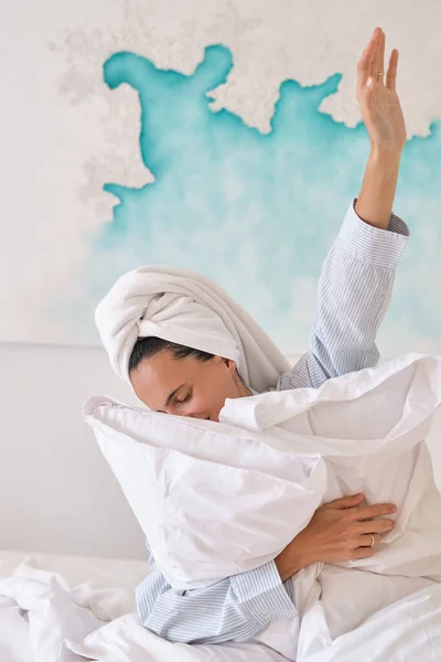 Happy Young Female Towel Wrapped Head Hugging White Pillows Sitting — Stock Photo, Image