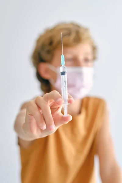 Child Sterile Mask Showing Injector Liquid Medicine While Looking Away — Stock Photo, Image