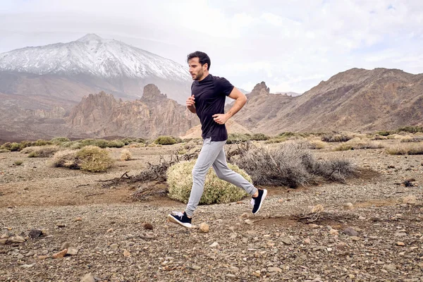 Full Body Side View Male Traveler Shirt Running Rocky Terrain — Stock Photo, Image