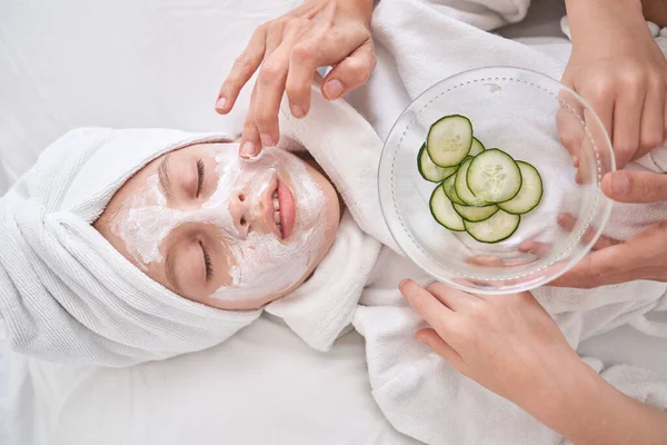 Top View Crop Anonymous Mother Applying Facial Mask Kid Bathrobe — Stock Photo, Image