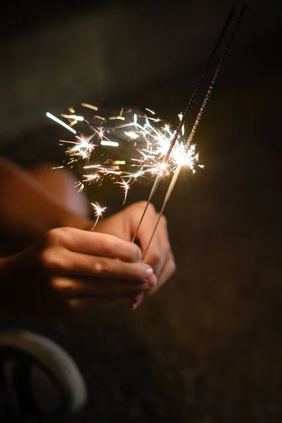 Anonymous Crop Person Holding Bright Burning Bengal Lights Celebrating Holiday — Stock Photo, Image