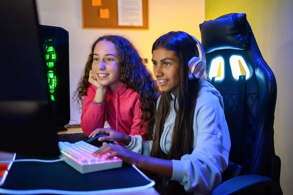 Positive Teenage Multiracial Looking Screen Monitor While Sitting Table Gaming — Stock Photo, Image