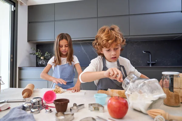 Adorable Children Aprons Making Sweet Dough Cookies Flour Table Various — Stock Photo, Image