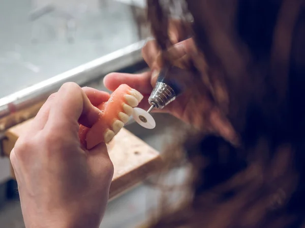 Faceless Anonymous Dental Technician Polishing Denture Rotary Machine Hand Selective — Stock Photo, Image