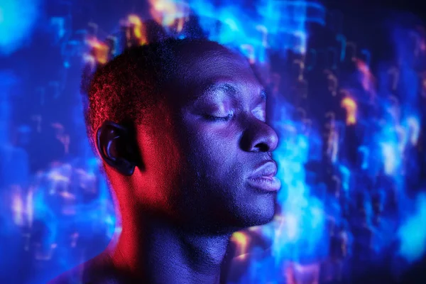 Calm African American Male Closed Eyes Blurred Colorful Neon Lights — Stock Photo, Image