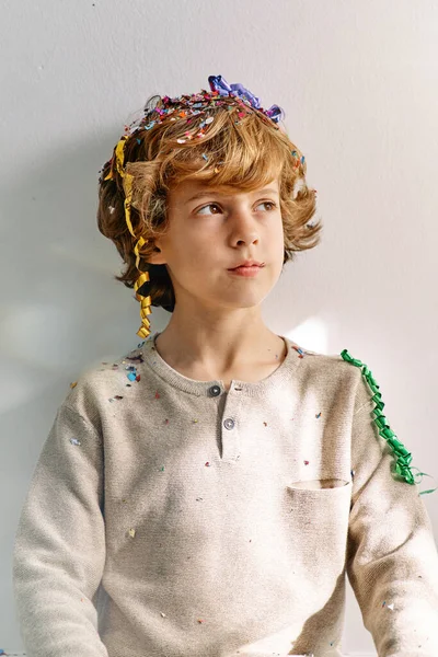 Pensive Preteen Boy Curly Blond Hair Colorful Confetti Head Looking — Stock Photo, Image