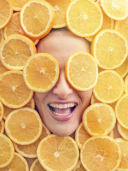 Top View Laughing Lady Lying Plenty Orange Slices While Pair — Stock Photo, Image