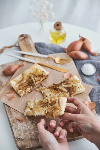 Crop Anonymous Person Taking Slice Tasty Homemade Puff Pastry Onion — Stock Photo, Image