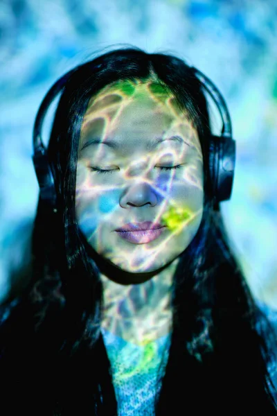 Attractive Asian Female Closed Eyes Listening Music Wireless Headphone While — Stock Photo, Image
