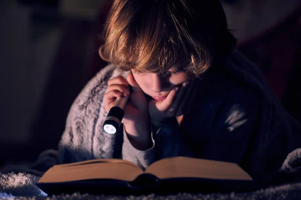 Calm Boy Reading Book Glowing Flashlight While Lying Bed Blanket — Stock Photo, Image