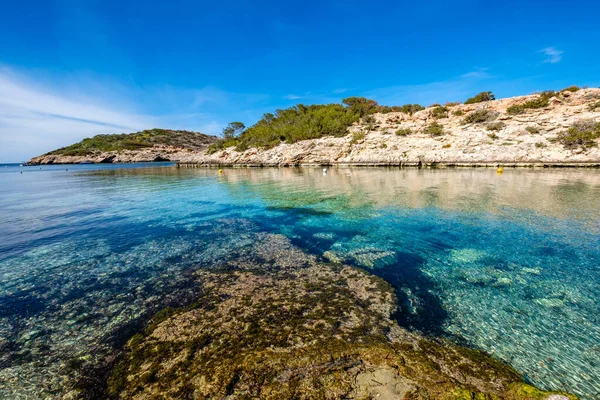 stock image Cala Portinax bay with beautiful azure blue sea water