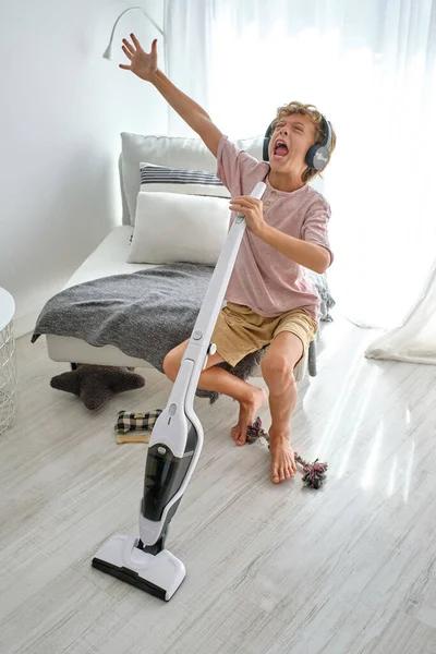 High Angle Barefoot Boy Raising Arm Yelling Vacuum Cleaner While — Stock Photo, Image