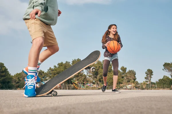 Teenage Boy Shorts Performing Tricks Skateboard Happy Girl Exercising Basketball — Stock Photo, Image
