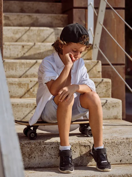 Full Body Preteen Skater Sitting Skateboard Stairs Building Alone While — Stock Photo, Image
