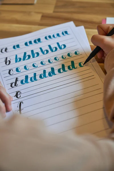 Anonymous Artist Learning Lettering Lesson Writing Lined Paper Sheet Placed — Stock Photo, Image