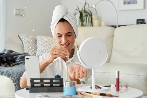 Cheerful Female Vlogger Turban Towel Head Applying Cosmetic Moisturizing Serum — Stock Photo, Image