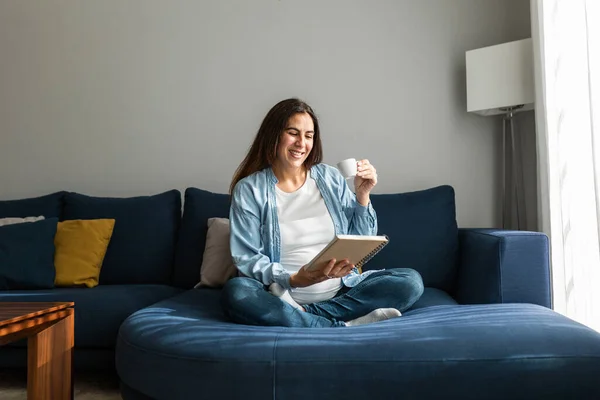 Positive Pregnant Female Sitting Soft Couch Notebook Drinking Hot Beverage — Stock Photo, Image