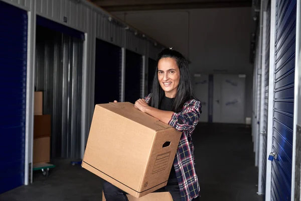 Optimistic Female Big Heavy Cardboard Box Smiling Looking Camera While — Stock Photo, Image