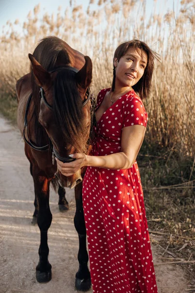 Young Female Long Red Dress Looking Away Horse While Standing — Stock Photo, Image