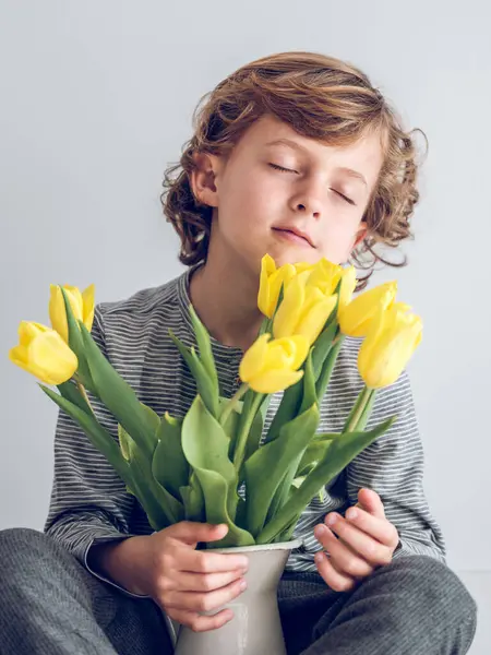 Adorable Kid Smelling Bunch Yellow Tulip Flowers Vase Enjoying Fresh — Stock Photo, Image