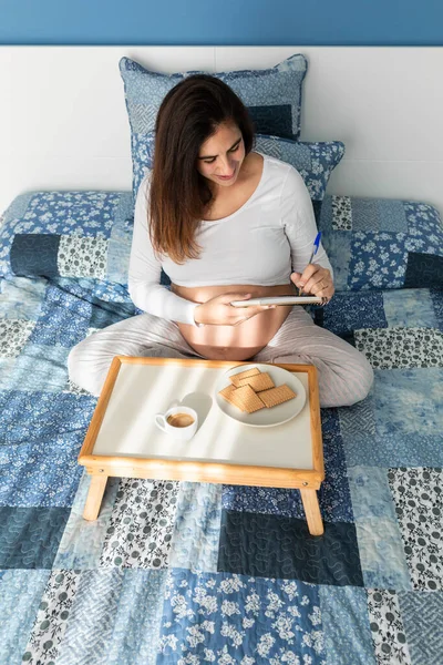 Pregnant Female Sitting Bed Writing Notebook Breakfast Morning — Stock Photo, Image