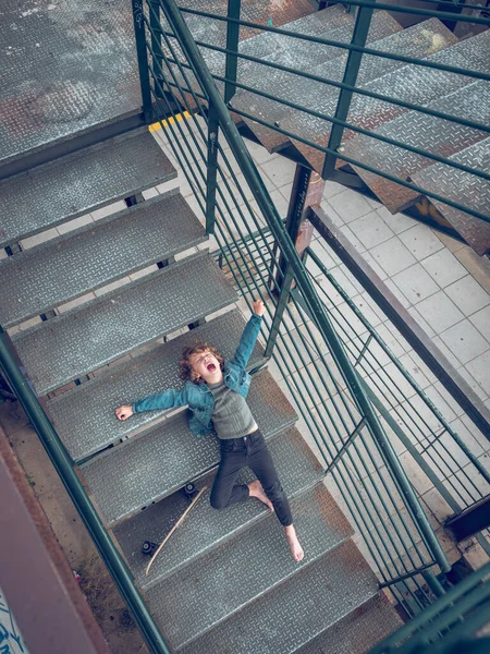 Full Body Preteen Boy Lying Steps Staircase Skateboard Screaming Loudly — Stock Photo, Image
