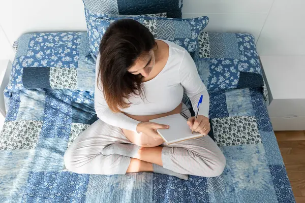 Pregnant Female Sitting Bed Writing Notebook Morning — Stok fotoğraf