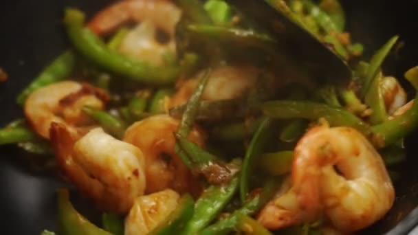 Crop Anonymous Person Stirring Tweezers Pan Stir Fried Shrimps Green — Stock Video