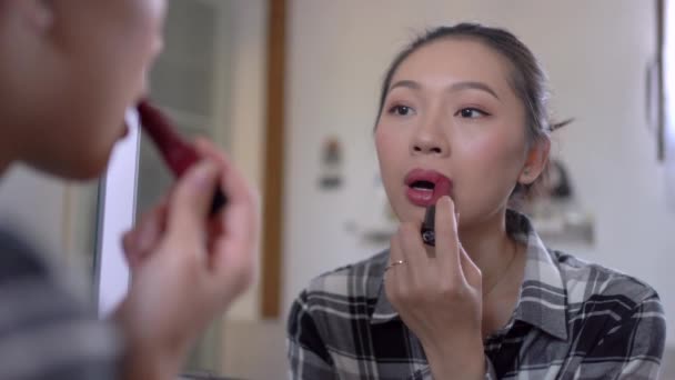 Young Attractive Asian Female Casual Clothes Applying Bright Lipstick While — Stock Video