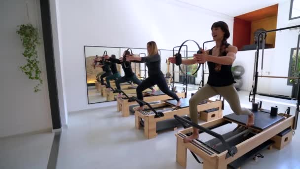 Group Fit Females Pilates Rings Doing Lunges Reformer Workout — Stock Video